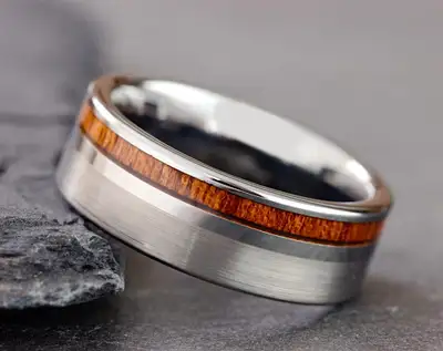 Selling this stunning Men’s tungsten ring featuring brushed silver and koa wood inlay. Original pric...