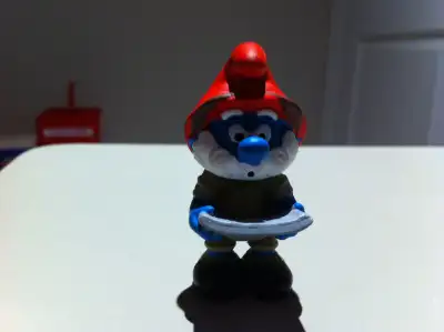 Brand new. It is a member of the 8-piece Jungle Smurf set. I also have a whole set for sale too.