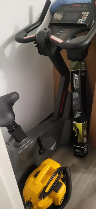 Exercise bike and weight bench., View more