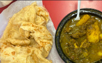 Boneless curry chicken with Guyanese style roti THE BEST….