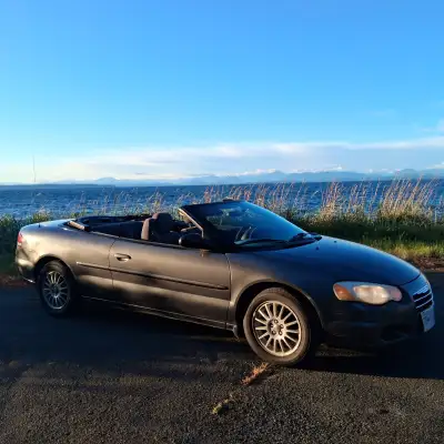 Runs and drives well. Power roof operates properly. Original cover in great shape. Roof has 4cm tear...