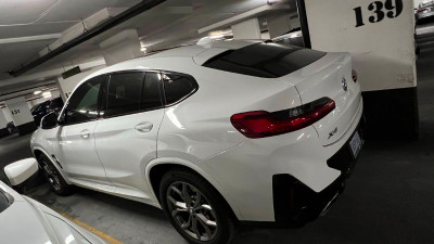 2 year BMW X4 for sale , asking $55000, with 4 snow tires