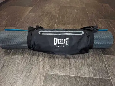 Everlast brand yoga mat carrier that clips closed (adjustable to carry bigger/smaller yoga mats), ha...