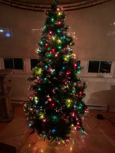 6.5-7 foot Xmas tree with fibre optic tips (that change colour) and regular lights throughout the tr...