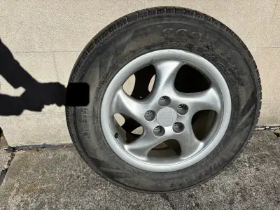 Set of four Porsche rims with tire size 235/65R17. Lug bolts are included. Tires type: Pirelli Scorp...