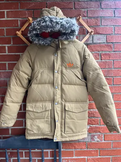 Adidas down parka featuring a detachable faux fur hood trim, View more