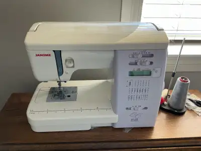 Please see picture Includes instruction book, extension for quilting, walking foot, cutting mats 1-...