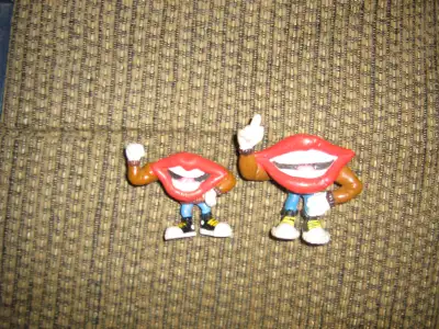 HEY FOR SALE ARE 2 TANG LIPS FIGURES MADE BY THE APPALAUSE COMPANY IN THE 80s. THEY ARE BOTH IN GOOD...