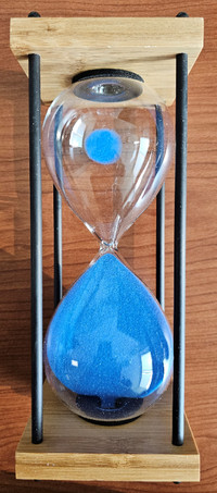 Sand hourglass with blue sand and wooden base