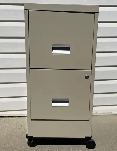 Keep your papers documents organized with this like new metal filing cabinet. Features two drawers w...