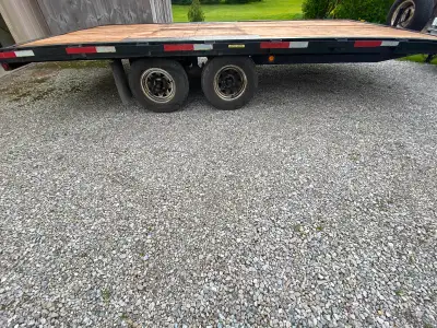 Flat deck 8x16 with rails all around. Newer oak decking and brakes. Trailer and tires are in good co...