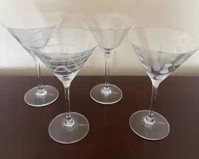 Beautiful set of 4 crystal martini glasses that coordinate with other glasses is the Cheers line fro...