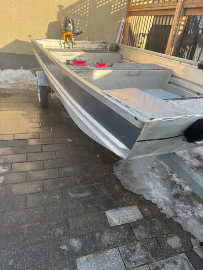2022 Marlon SP12 Jon Boat with 2022 Mercury 6 HP four stroke motor on 2025 Marlon galvanized trailer...