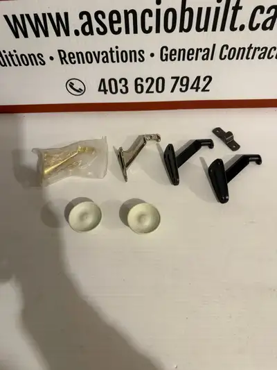 Handy lot of handrail brackets and caps. One brass bracket new in plastic. Also has one silver brack...