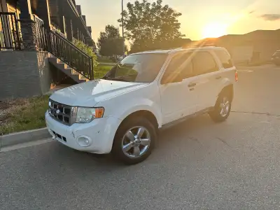 2011 Ford Escape AWD (3.0L) with 236,000km. Mechanically sound suv with command start, lots of tread...