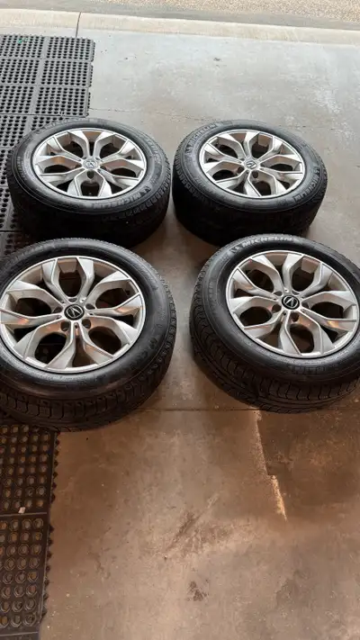 I'm selling a set of four winter tires mounted on alloy rims, size 235/60R18. These tires are Michel...