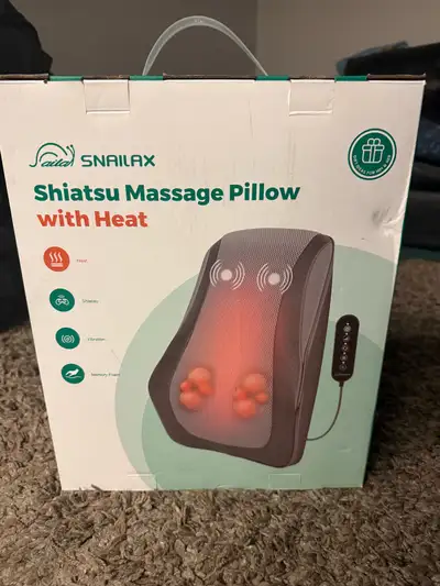 Brand new in box. It’s memory foam and has vibration, and heat gives a lovely shiatus type massage....