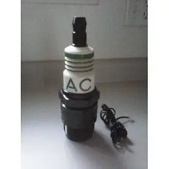 Vintage 1985 Synanon AC Spark Plug Phone, key pad is at the bottom of the phone, it's in working con...