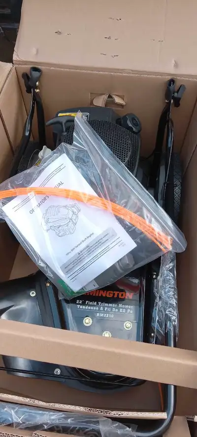 Remington field mower 22 in string cutter, new in box. Bought it never used it 195cc engine. Look to...