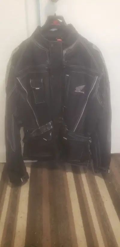 Selling a very lightly used Honda touring and adventure motorcycle jacket in size XL. It fits true t...