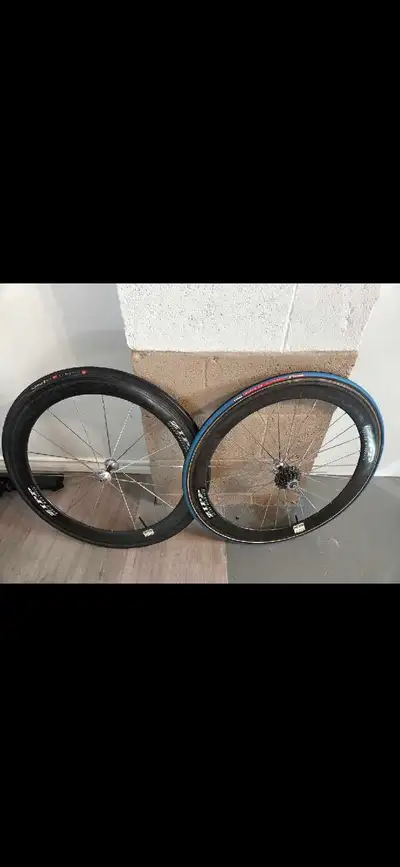 Carbon wheel set. Tubular. 23 M tires that are both brand new, View more