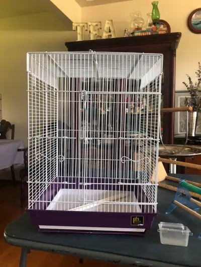 White and purple bird cages comes with perch and dishes Travel size