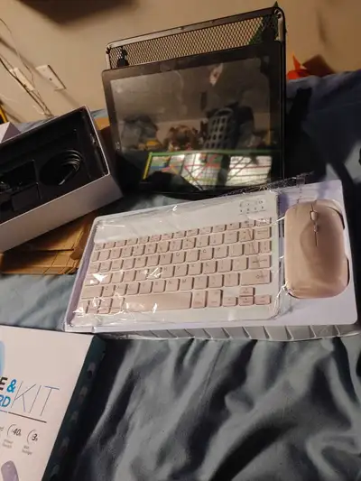 tablet with pink accessories, View more