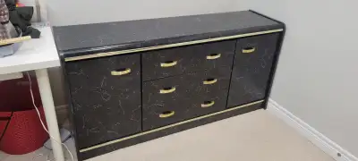 This sideboard offers both style and functionality with its striking black marble effect and elegant...