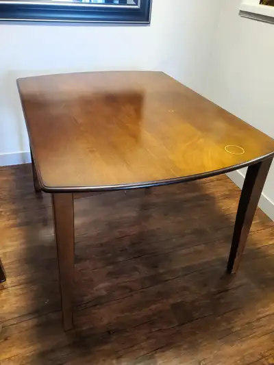 Kitchen table, solid wood. Top has some wear marks, but is sturdy & strong. Table measures 47.5” x 3...