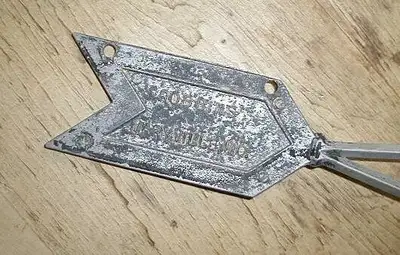Antique Robbins, Maryville, Mo. directional arrow, 20 inches long x 2 1/2 inches tall. In excellent...