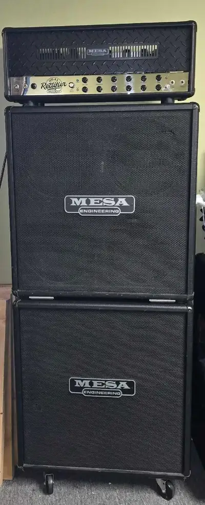 2- 4x12 cabs loaded with mesa black shadow c90 speakers. These are rare 1/4 open back cabs from 2000...