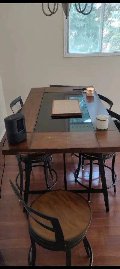 Dining table with glass center piece and 6 chairs (one is dismantled). PICK-UP ONLY