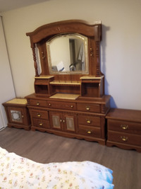 Large dresser with two matching night tables.