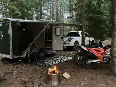 2020 7 x 12 V-nose fully aluminum trailer converted to an off-grid mini toy hauler/hunt camp. The tr...