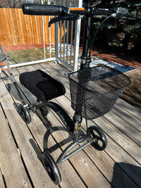 Knee scooter with hand brakes, basket and removable soft cover.