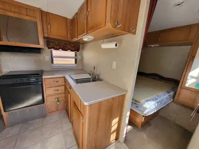 Such an awesome trailer! Perfect for a family! It has a slide and bunks! Tons of storage with a rear...