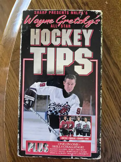 Own a piece of hockey history with this Wayne Gretzky's Hockey Tips VHS tape, a vintage instructiona...