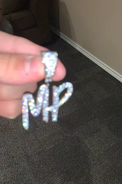I make custom Moissanite VVS Pendants prices vary on letters, font and size . Also on Facebook!!