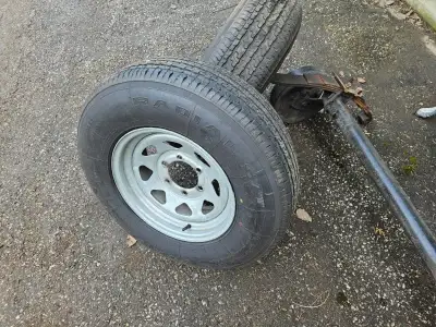 Trailer axle only with springs 5200lb 4 inch drop axel with good breaks, 2 15 inch new galvanized wh...