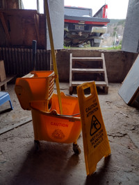 Industrial bucket,mop handle and caution sign