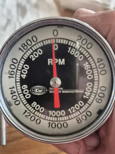 Vintage handheld auto tachometer used for testing wheel speed when balancing