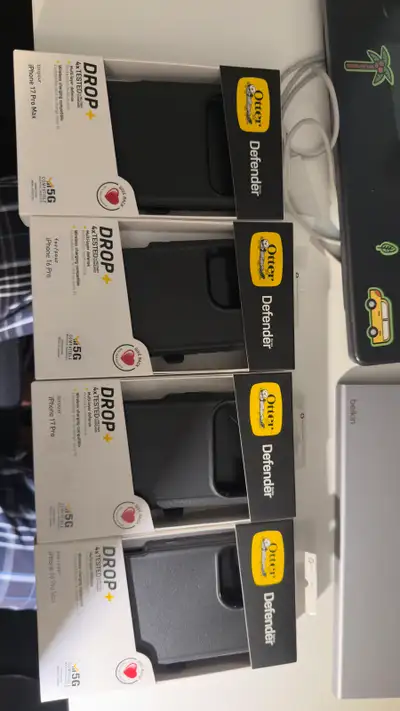 I have a selection of new Otterbox Defender cases designed for various iPhone models including the 1...