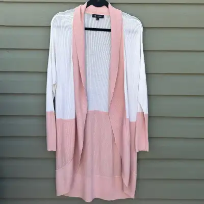 White and pink knit cardigan from Lily Morgan. White knit upper with pink ribbed bottom and sleeve c...