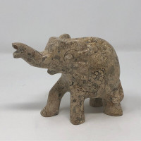 Carved Elephant Raised Trunk Quartz Inclusions