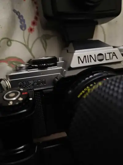 MAXUM 5000 The Minolta XG-M comes equipped with a versatile zoom lens, ensuring you're prepared for...