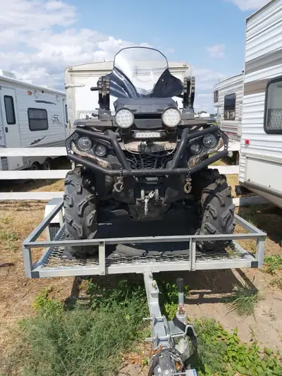 2015 Quad. In great condition. Has front and back remote winches. All bags and gun holder included....