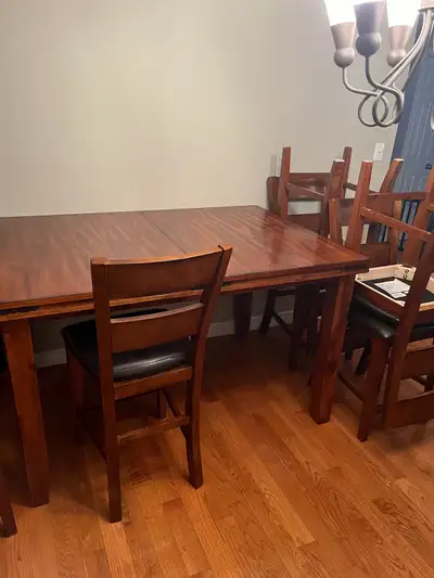 Like new, well built, bar height, cushioned chairs Table - 5’ x 42” Leaf - 18” w Legs - 35” h We rec...