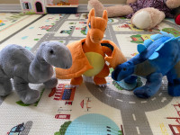 Three stuffed dinosaurs 
