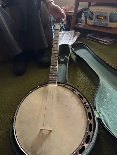 This is a vintage mahogany banjo that would be a great addition to any bluegrass collection!. It is...