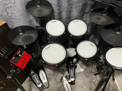 Like-new Alesis Nitro Pro Drum kit. It is also expanded with the Nitro Max expansion pack: a third c...